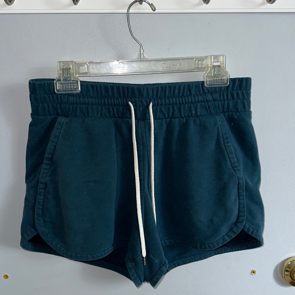 Blue Champion shorts with pockets and adjustable waist.